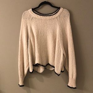 Sweater with scalloped bottom